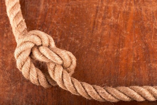 rope-with-reef-knot-wood-texture-background_372197-3665.jpeg
